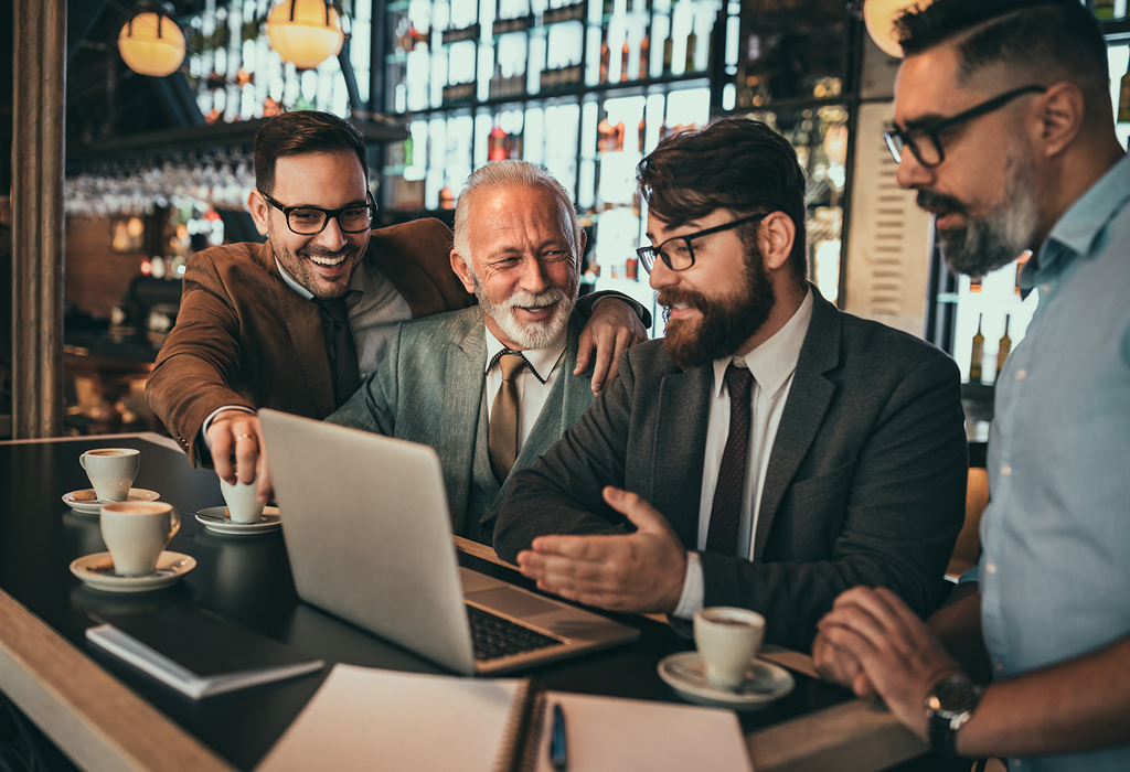 group of positive man having good time together